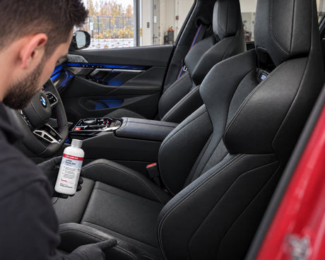 Detailing1 BMW leather care — greasy shine on the seat bolster of a BMW M5, Daniel with COLOURLOCK Leather Cleaner (Mild)