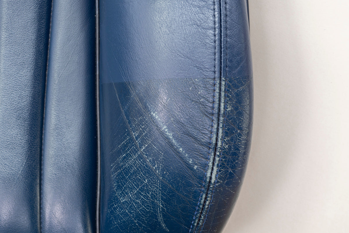 Detailing1 COLOURLOCK Leather Colour — worn, scratched seat bolster in blue smooth leather